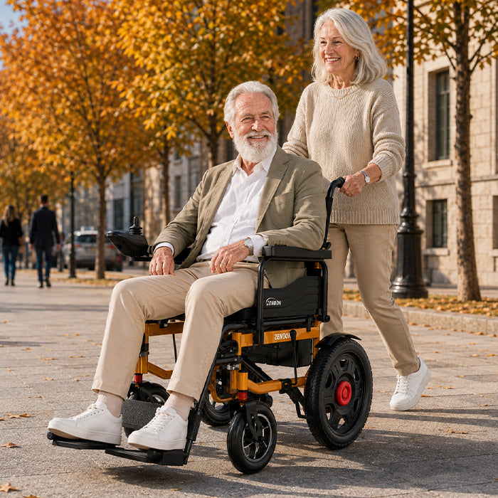 Senior couple enjoying an autumn outing with the ZENBON Titan Pro wheelchair
