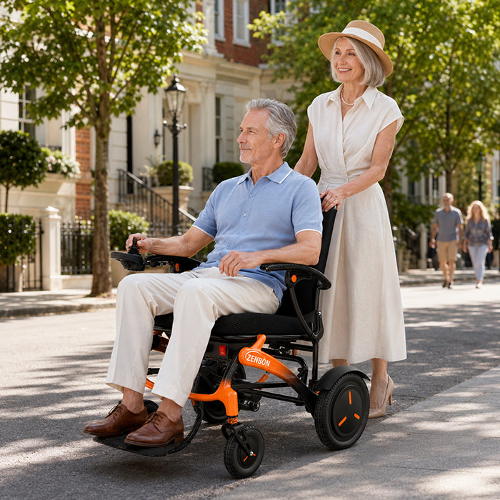 Adult riding the ZENBON FoldX electric wheelchair outdoors