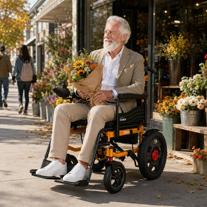 Senior man riding the ZENBON Titan Pro power wheelchair in a park