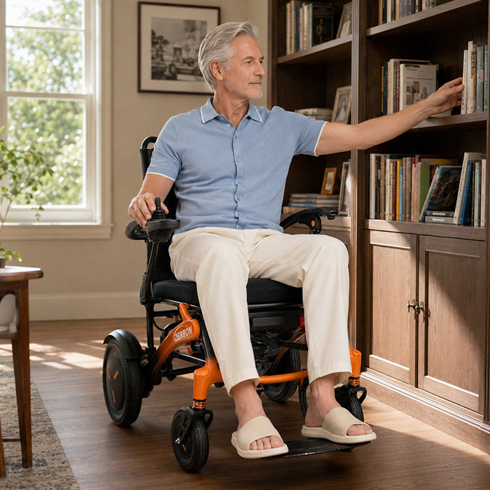 Adult using the ZENBON FoldX electric wheelchair indoors at home